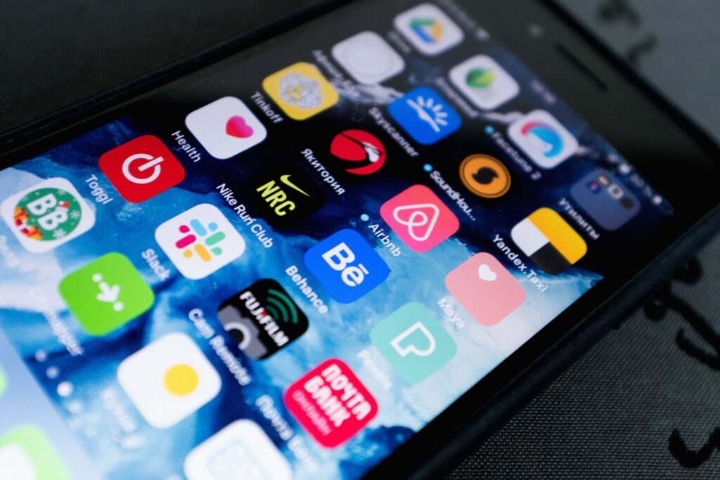 Smartphone home screen full of app icons